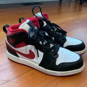 Air Jordan 1 Mid, Black, White, and Red Sneakers